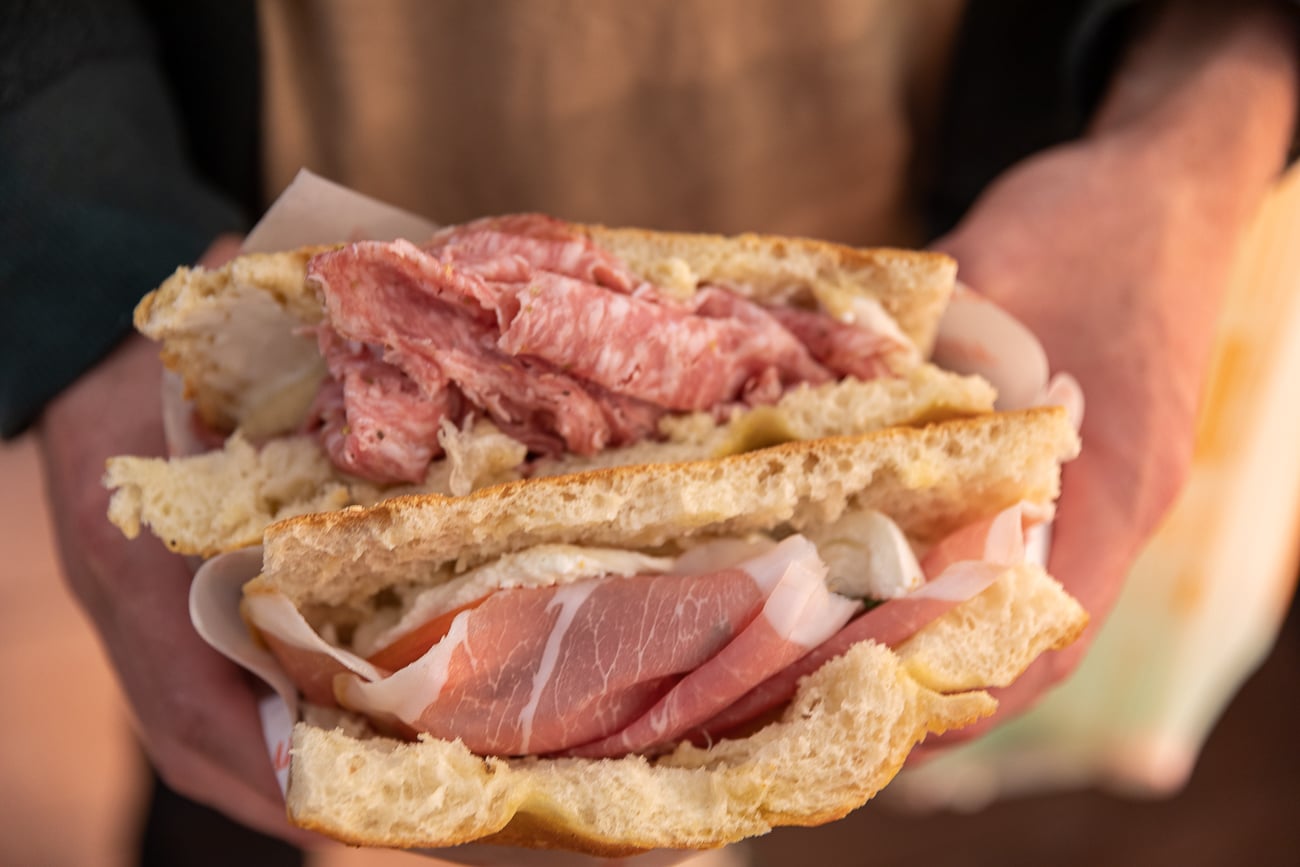 Schiacciata sandwich filled with salame toscana, prosciutto, and burrata from All'Antico Vinaio in Florence.