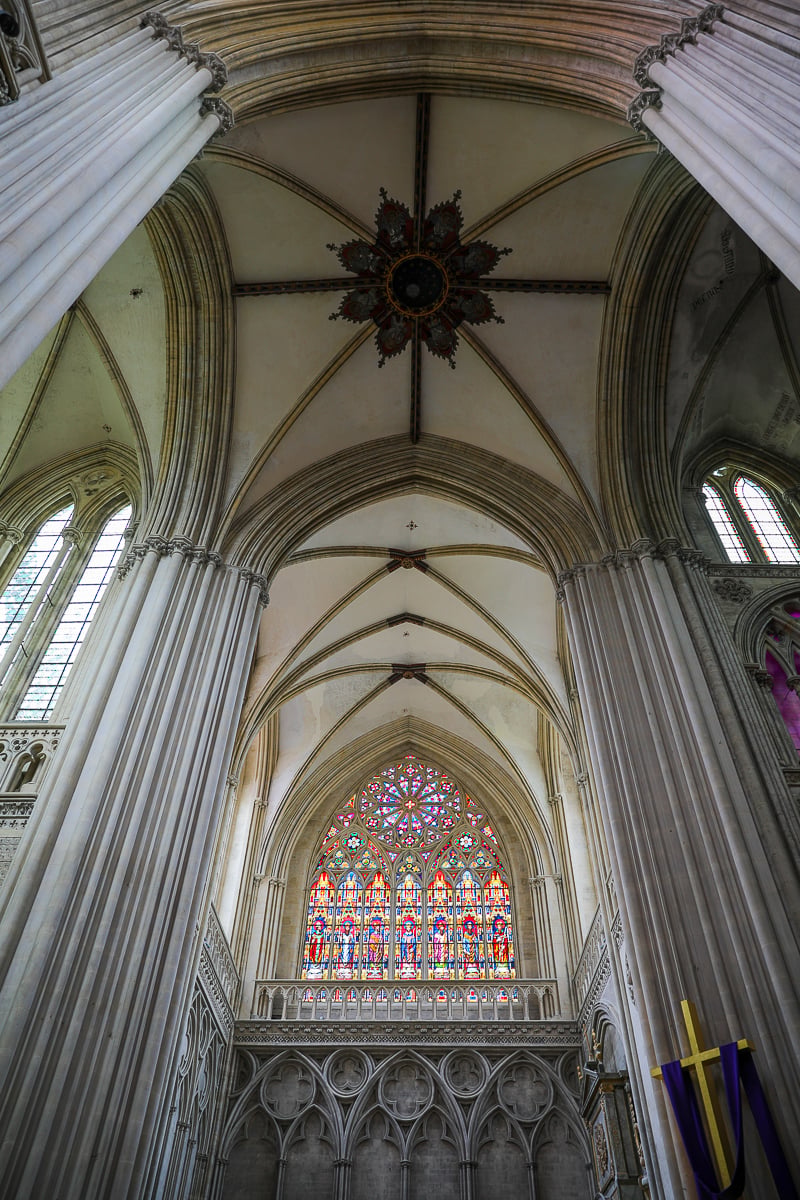 Soaring vaulted nave and stained glass window inside Cathédrale Notre-Dame de Bayeux, Normandy
