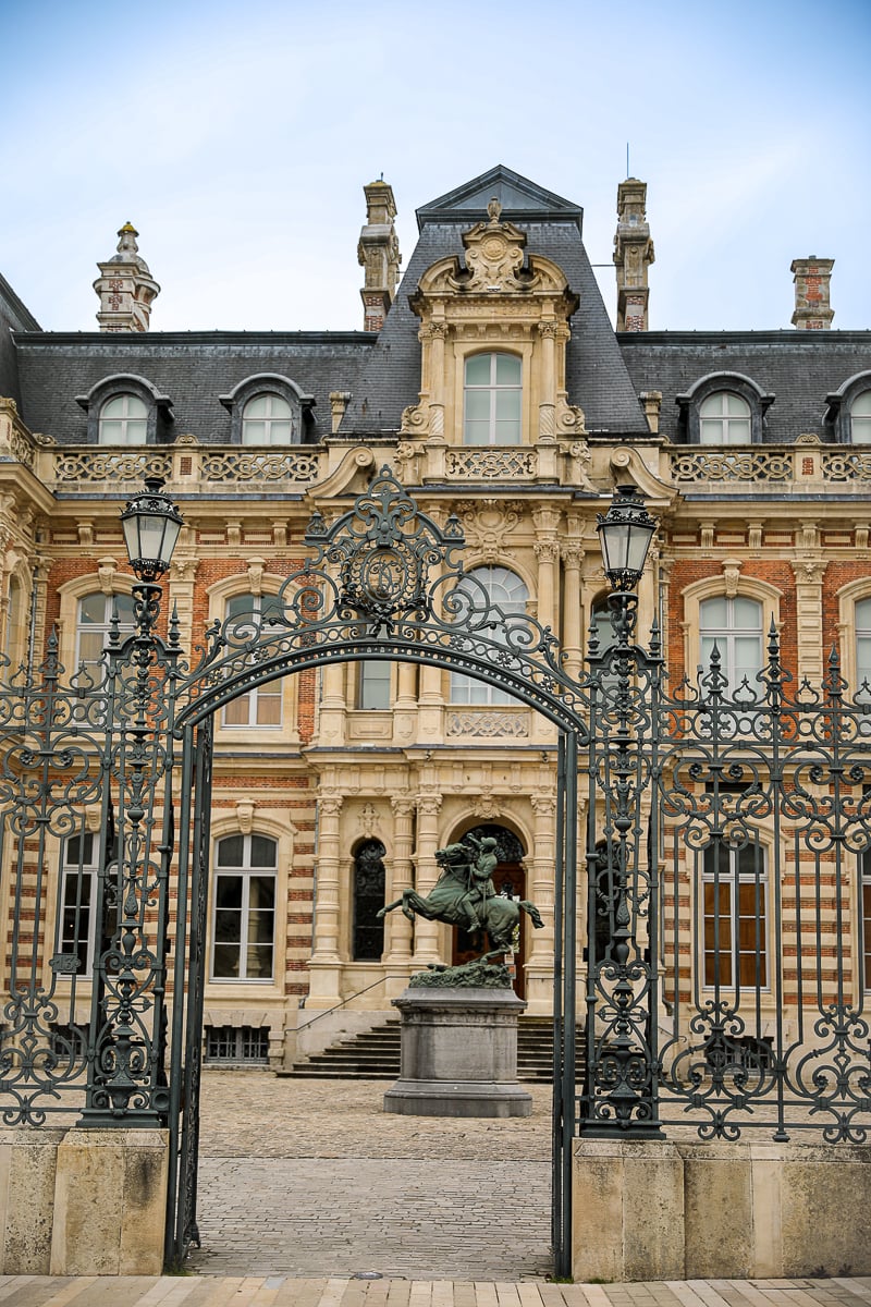 Ornate Champagne house mansion behind a wrought-iron gate on the Avenue de Champagne in Épernay