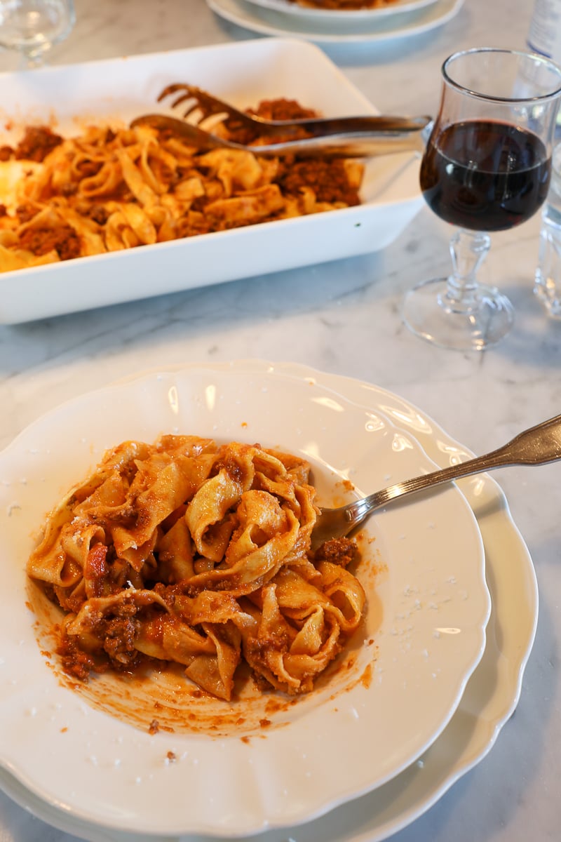 Fresh pappardelle pasta with Tuscan-style wild boar ragù, made from scratch during a Tuscan farmhouse cooking class.