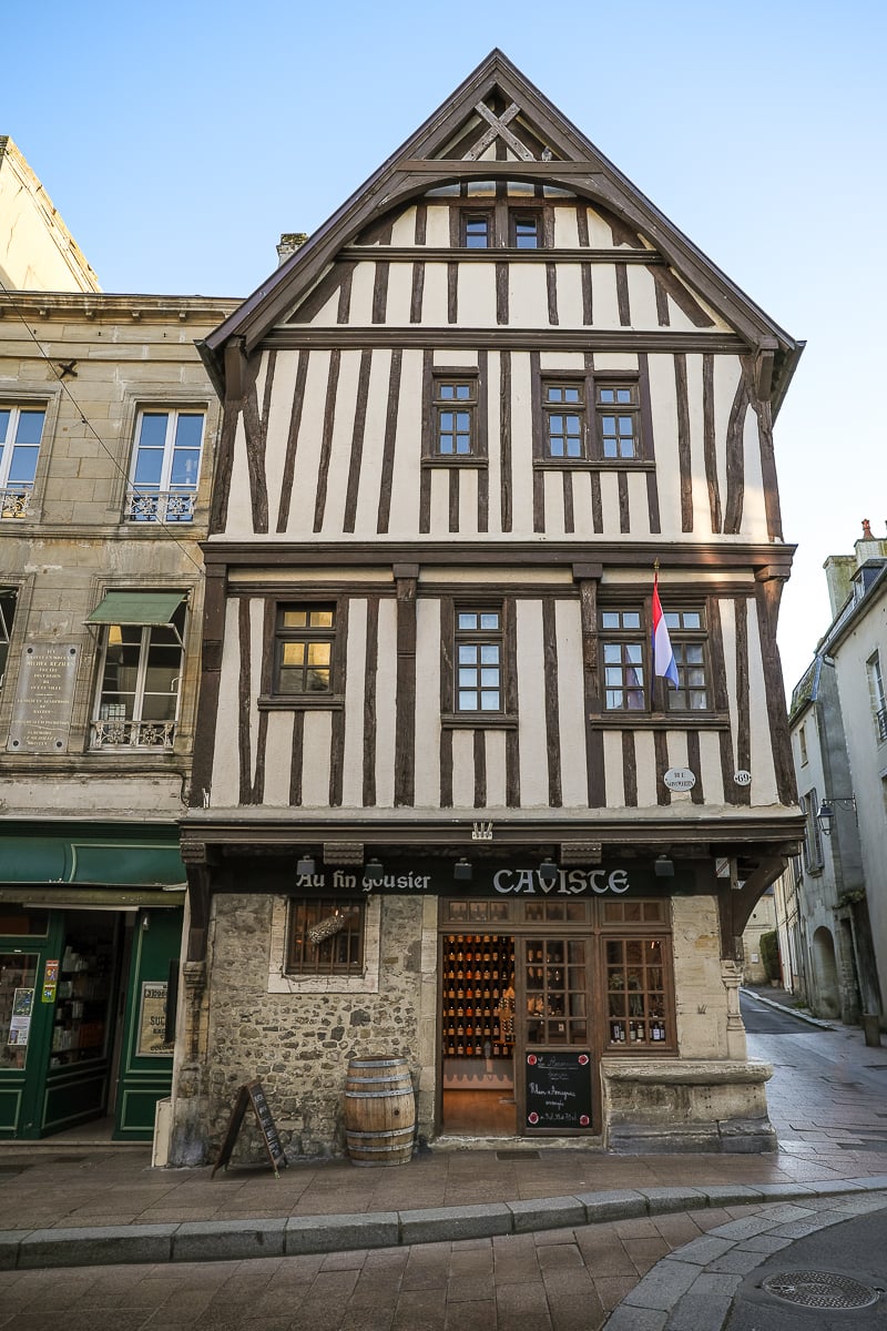 Au Fin Gousier caviste in a historic half-timbered building in Bayeux