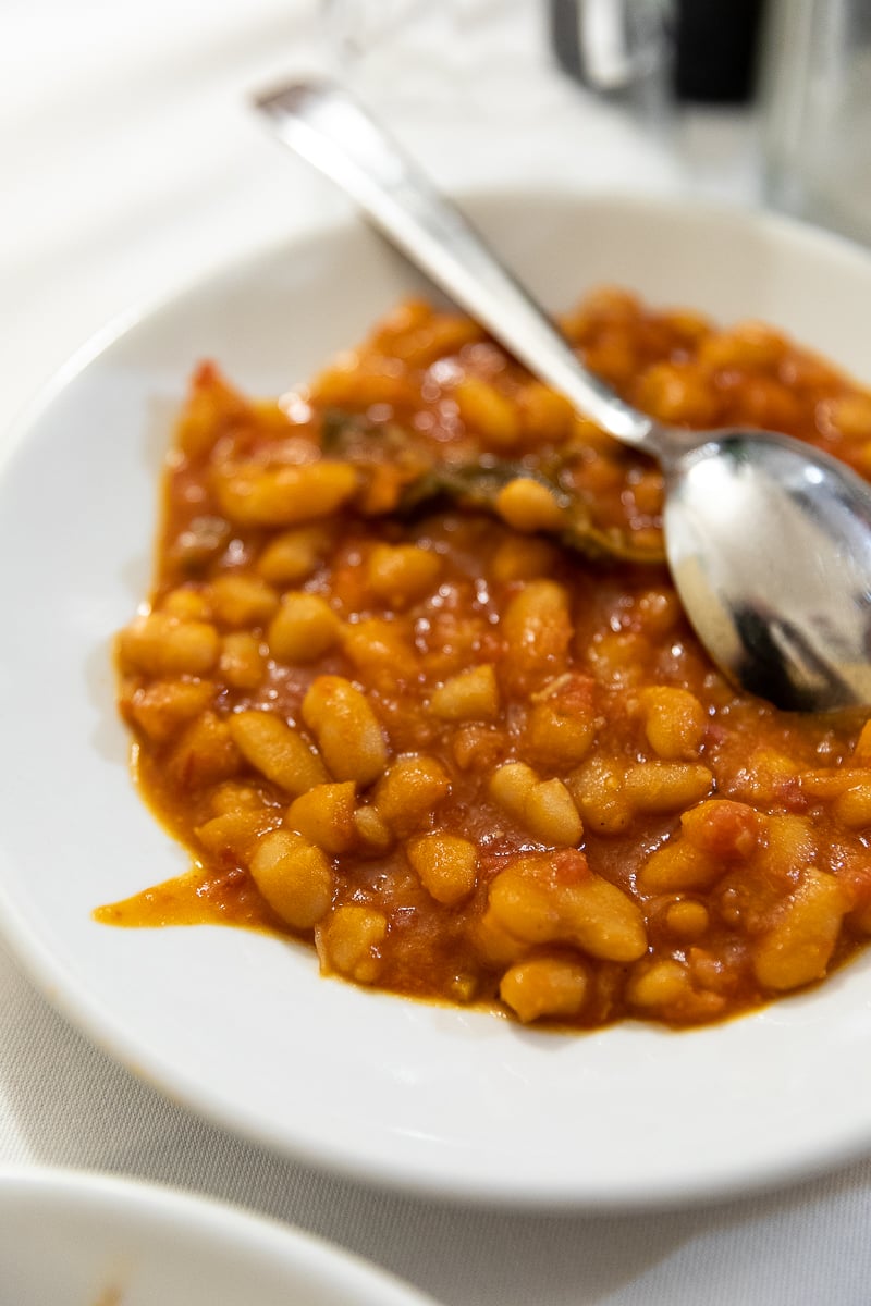 Tuscan white beans simmered in tomato sauce, a classic side dish at I'Brindellone in Florence.