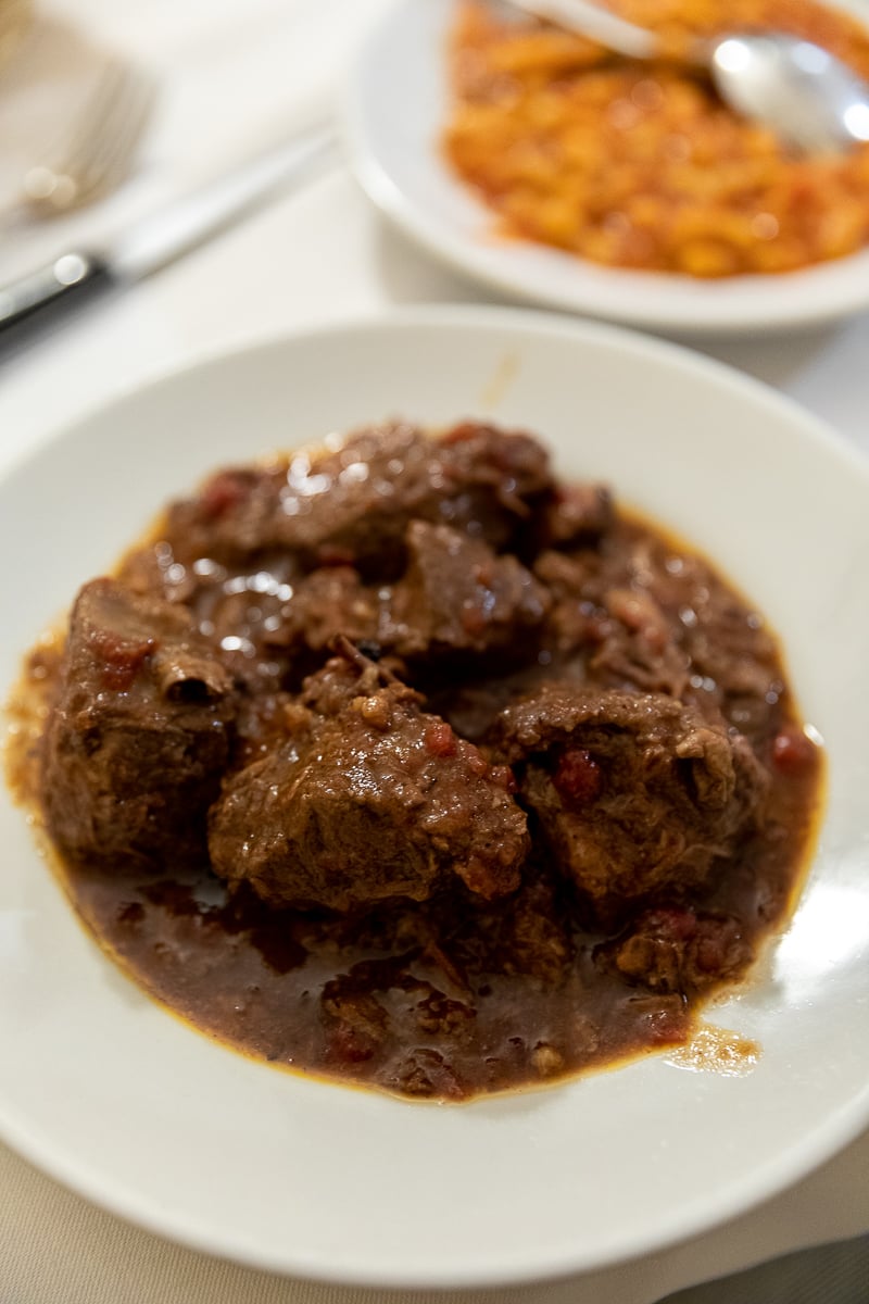 Peposo, a slow-cooked Tuscan beef stew in rich tomato and pepper sauce, served at I'Brindellone in Florence.