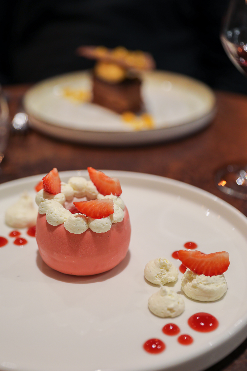 Strawberry mousse dessert with whipped cream and fresh strawberries at L'Alcôve restaurant, Bayeux, Normandy