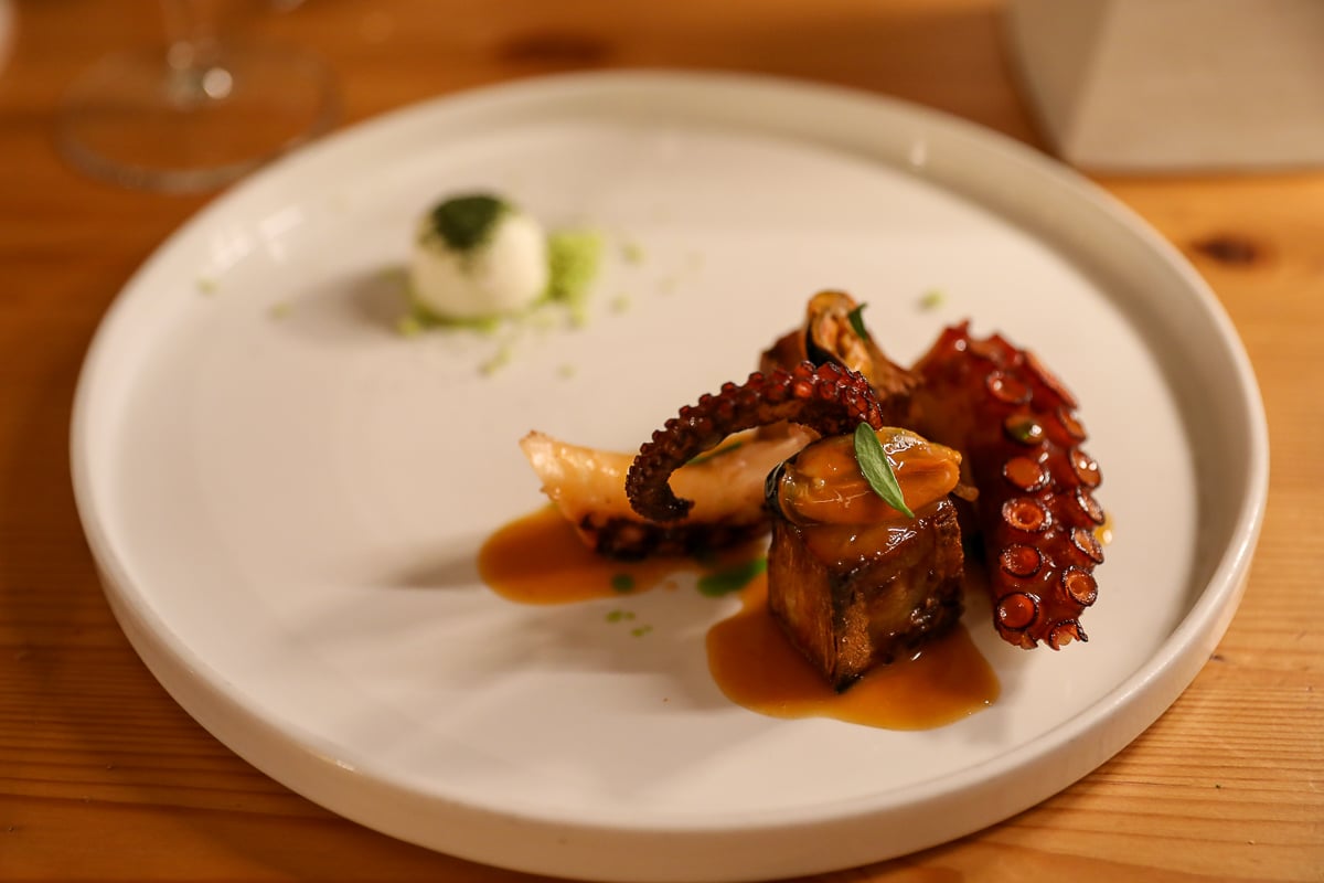Seared octopus with crispy pork belly, mussels, and buffalo mozzarella panna cotta at Nugolo in Florence.