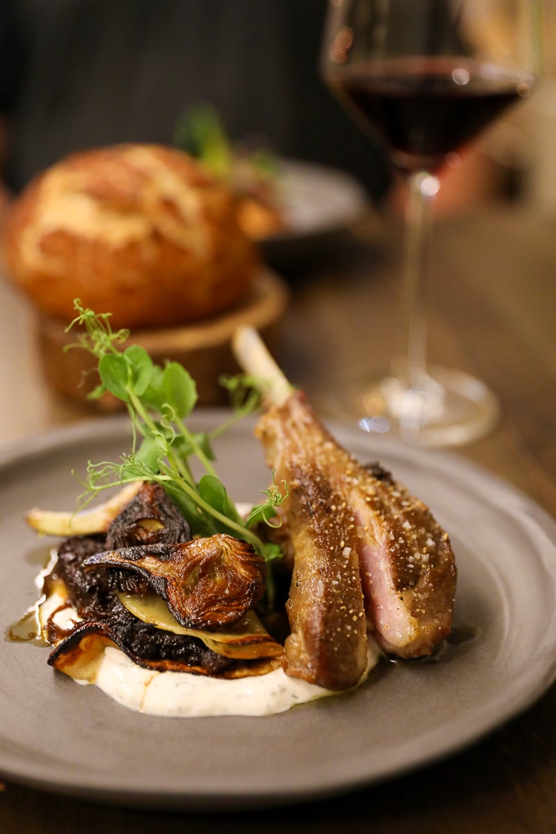 Lamb chop and kofta with roasted artichokes, onion confit, and creamy sauce at Biz’tro Chic & Gourmand