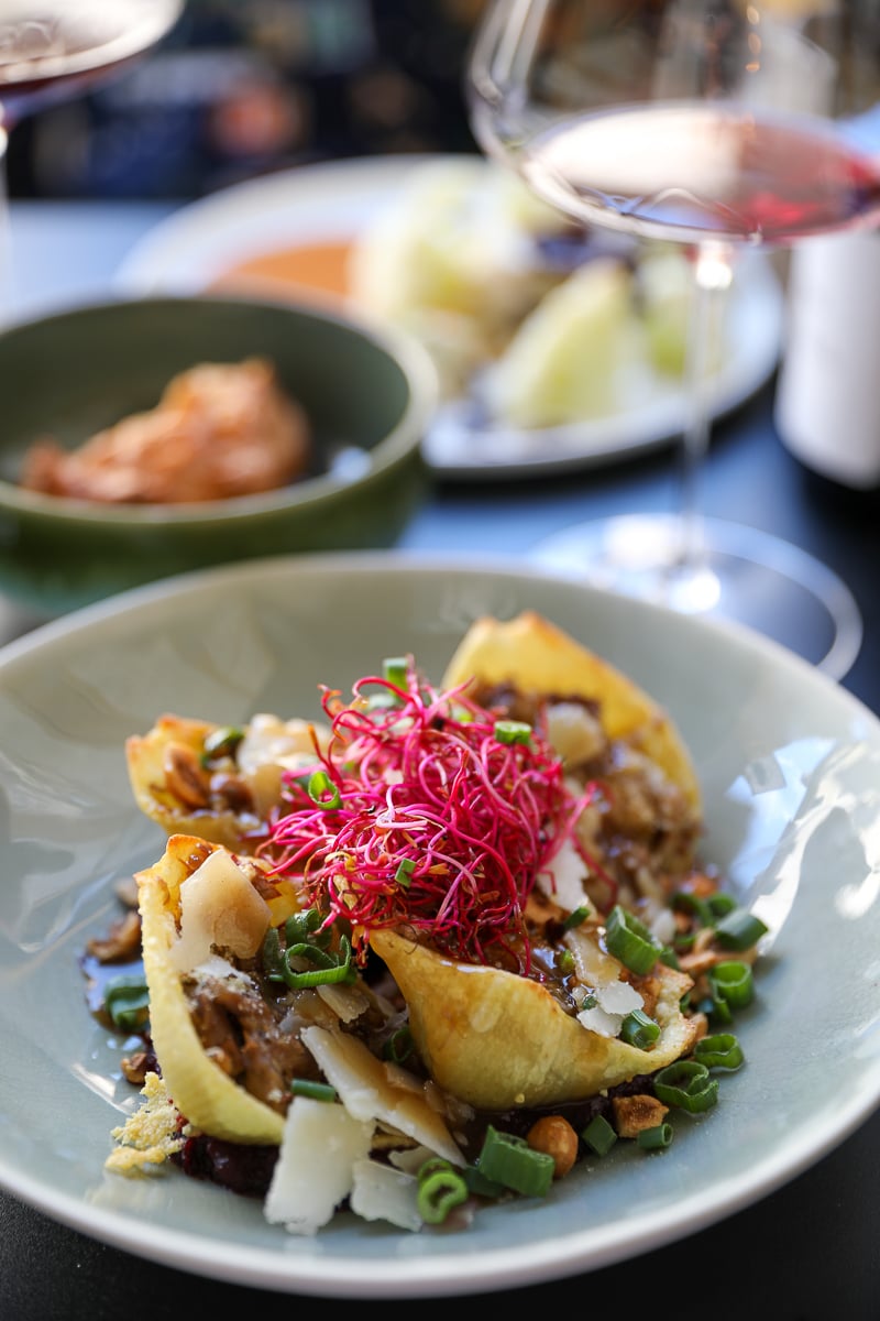 Conchiglioni pasta with duck confit, Parmesan, hazelnuts, and fresh greens at Rebond restaurant