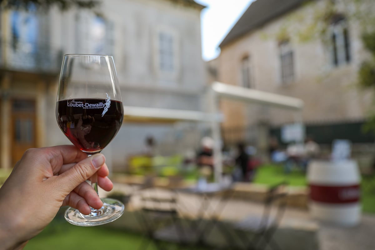 Glass of Burgundy Pinot Noir at Domaine Loubet-Dewailly wine tasting in Beaune, France
