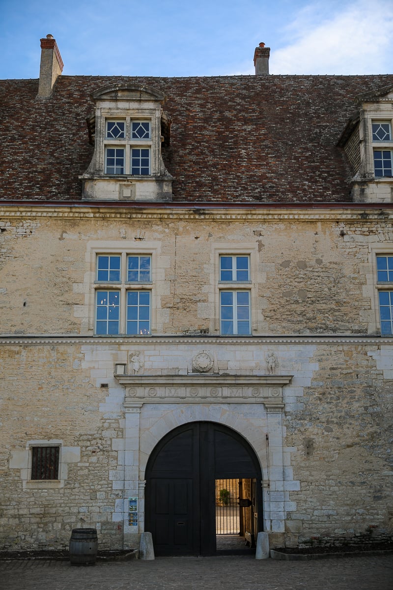 Historic stone wine domaine with an arched entrance in Burgundy, France