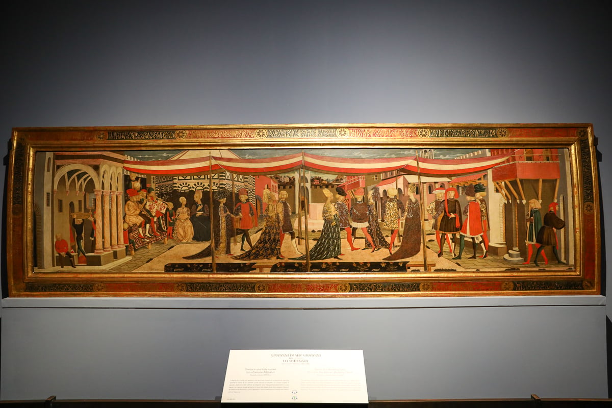1. Long Renaissance panel painting depicting an elaborate procession, displayed inside Florence’s Accademia Gallery.