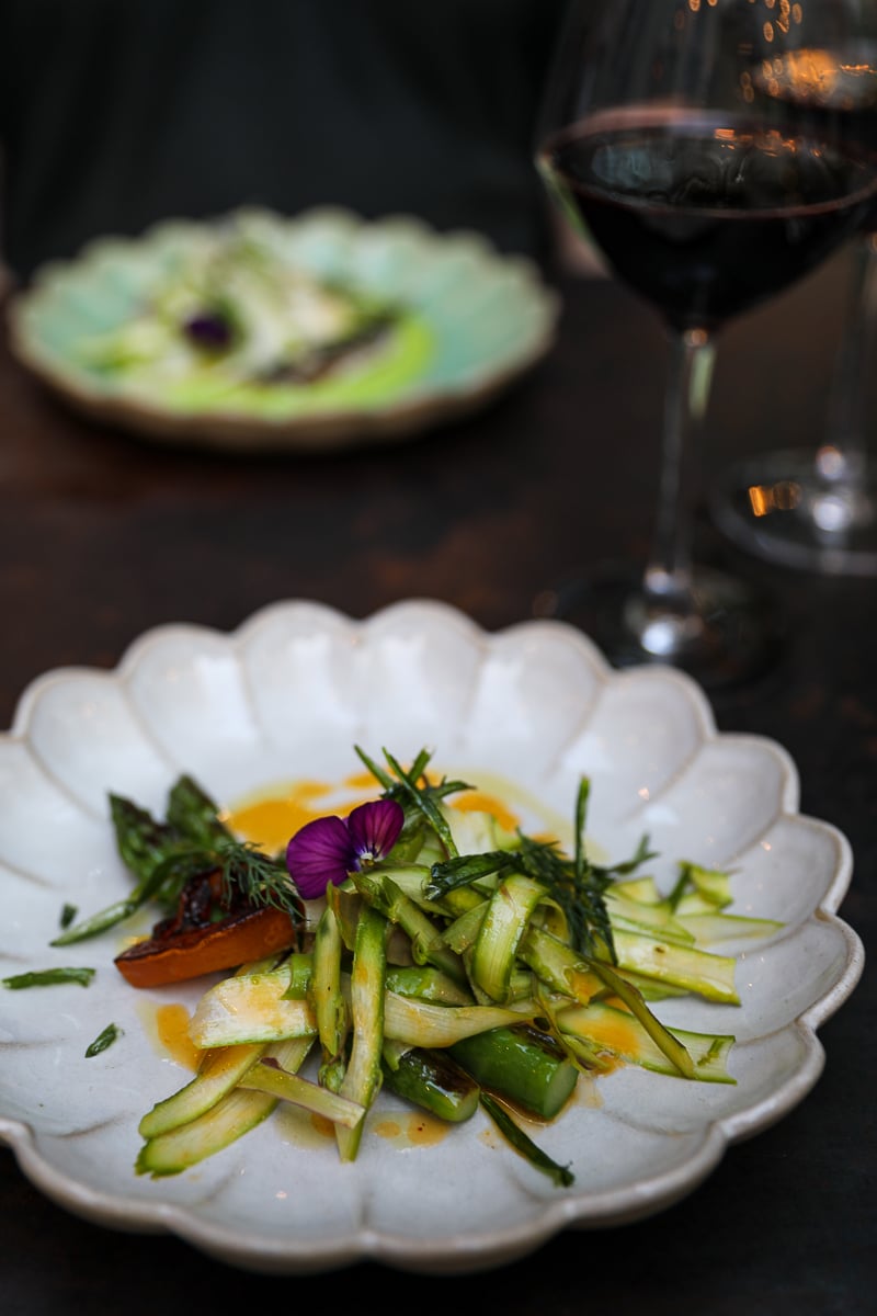 Seasonal asparagus starter with red wine at Café Roma