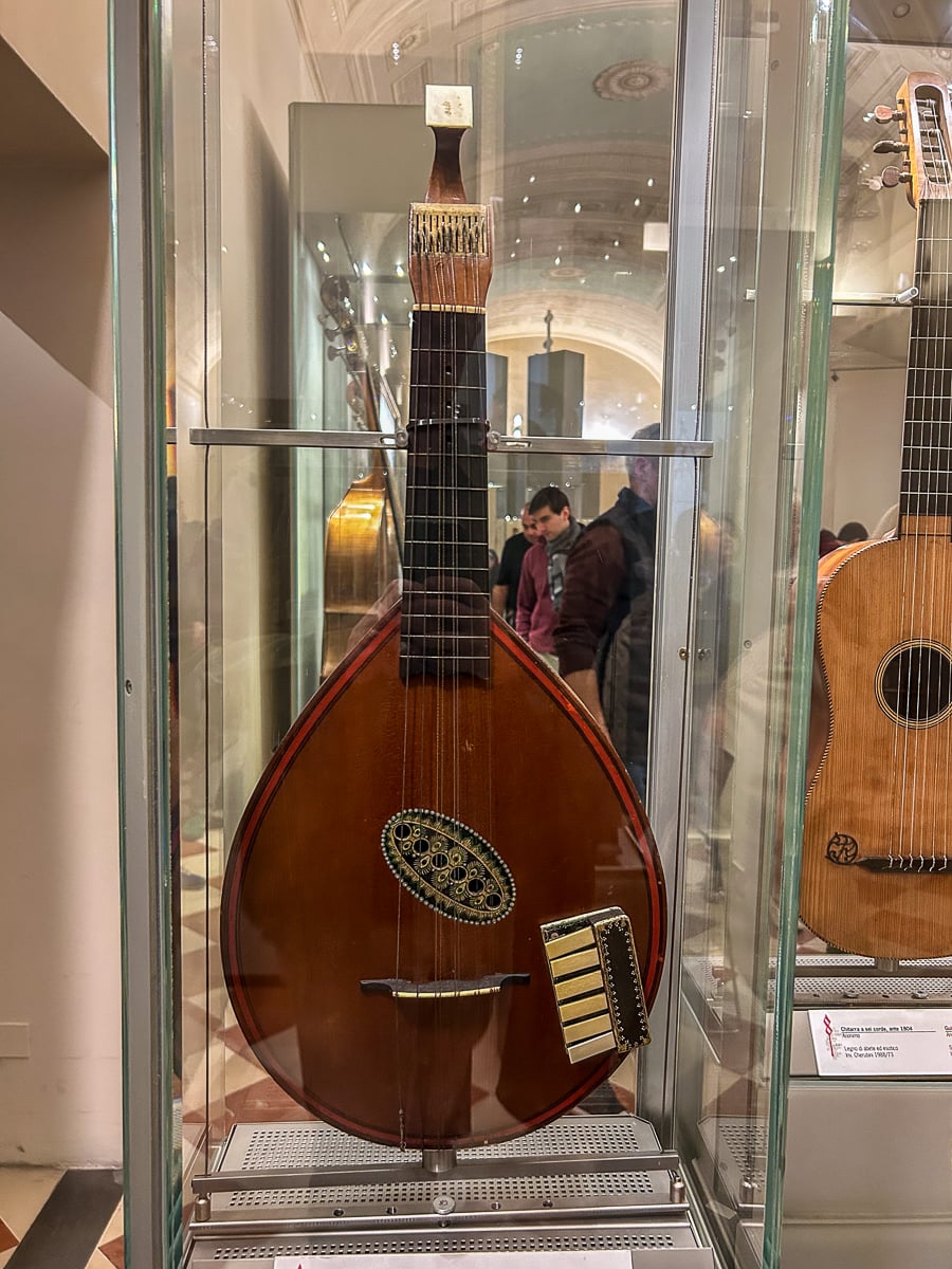 Historic stringed instrument displayed in the musical instruments collection at the Accademia Gallery in Florence.