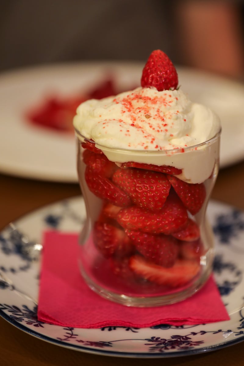 Fresh Provençal strawberries with cream for dessert at La Fourchette in Avignon