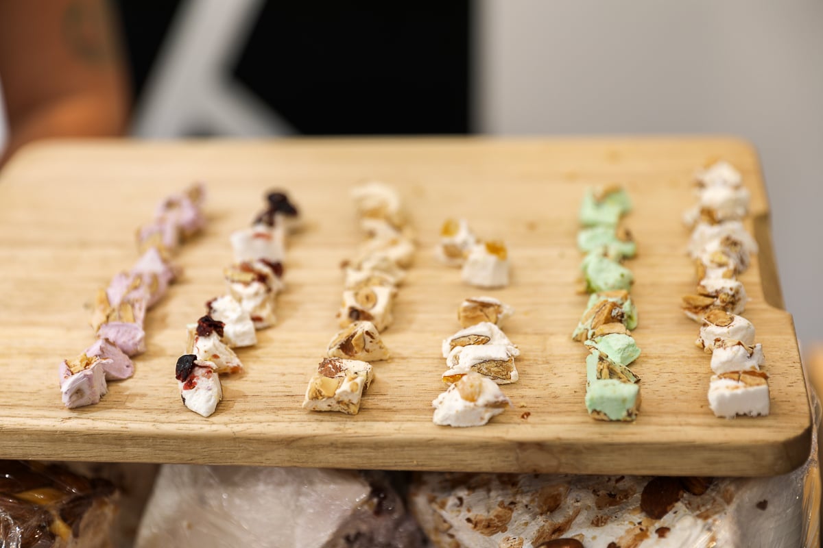 Colorful French nougat samples at a food shop during a food tour