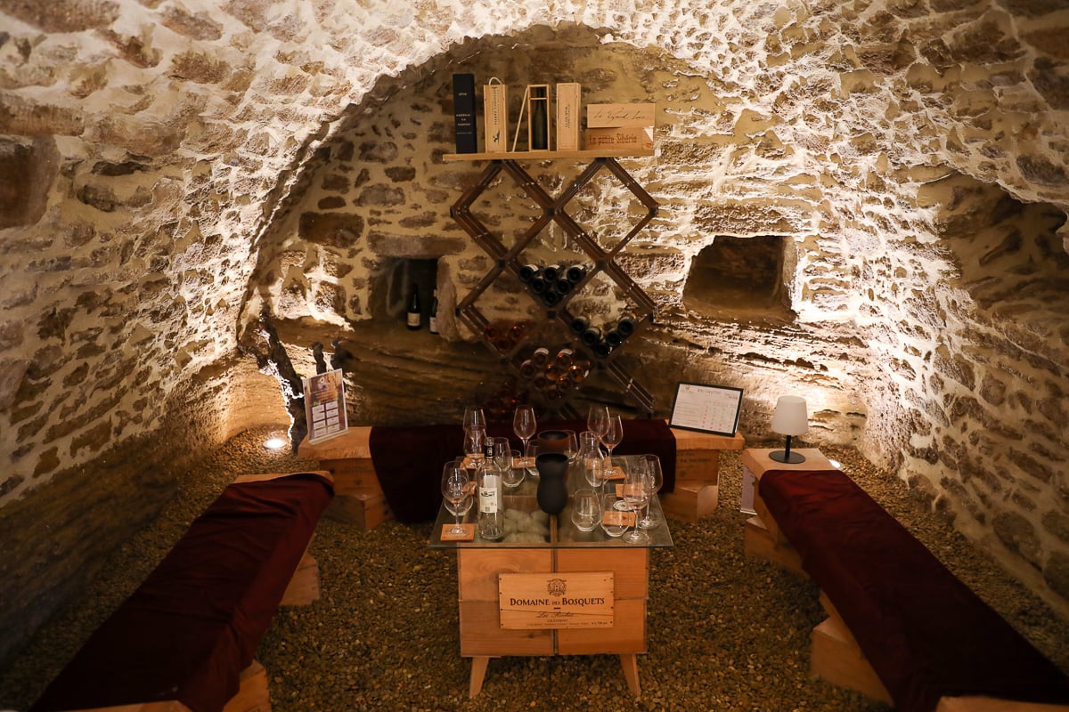 Intimate stone wine tasting room at La Nez des Papes in Châteauneuf-du-Pape village