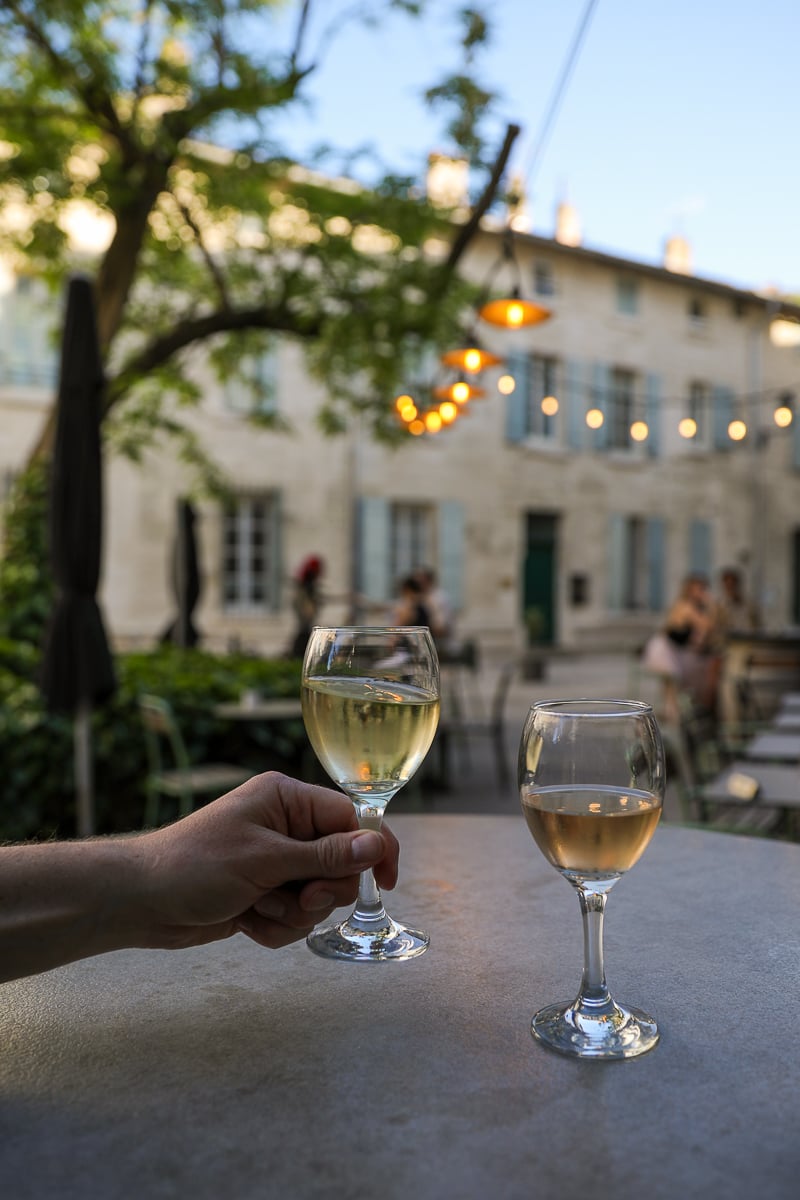 Glasses of local wine on a leafy terrace in Villeneuve-lès-Avignon